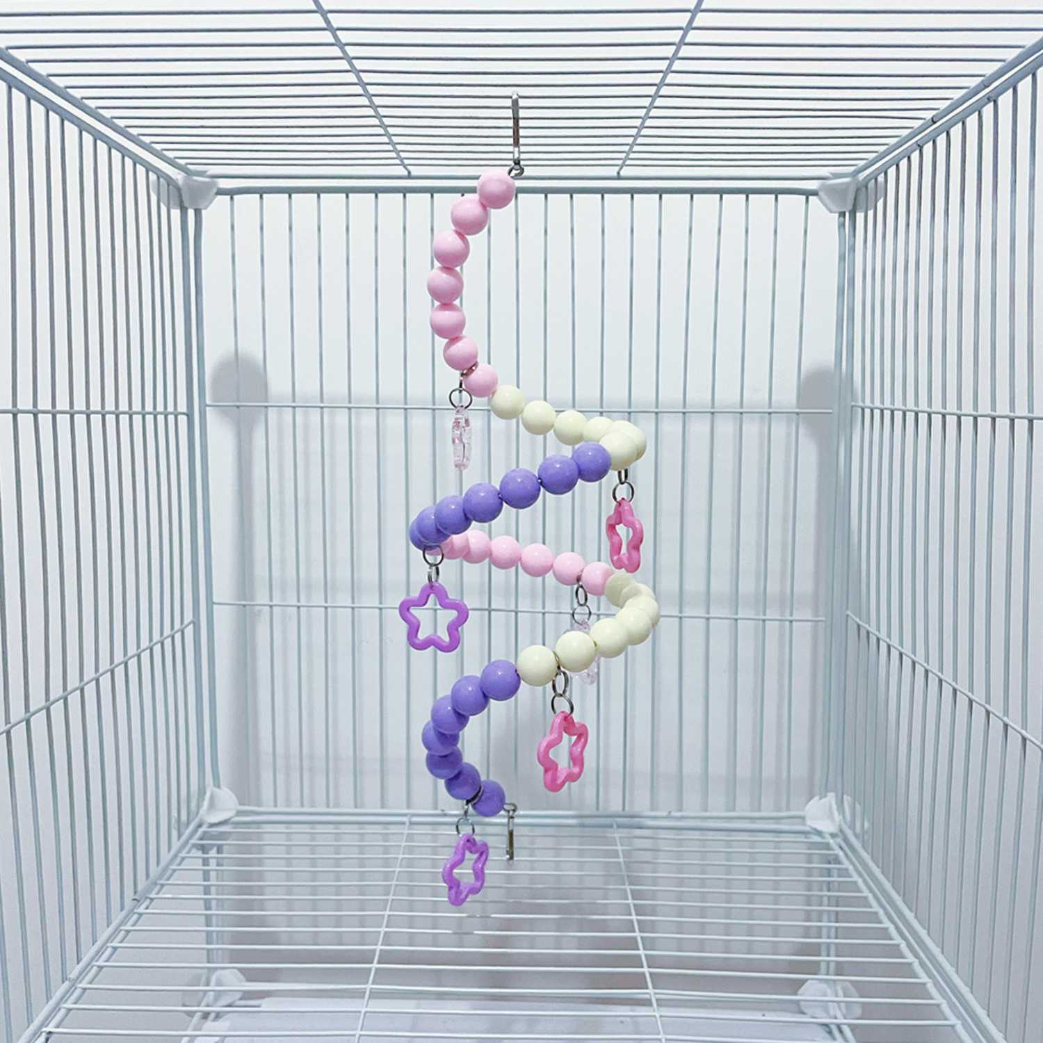 vogel speelbrug dubbele spiraal met paarse en roze kralen en sterren